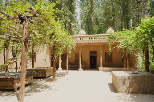 Free Explore a traditional mud-brick house nestled in greenery, showcasing unique architecture and cultural design. Stock Photo