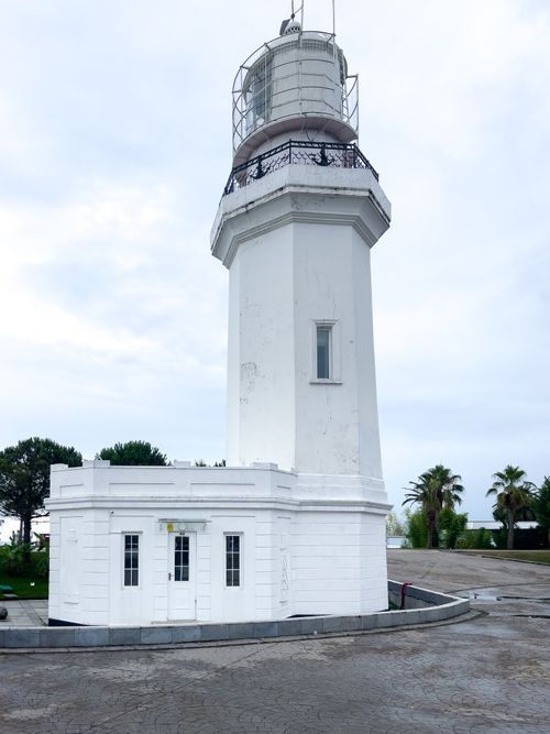 Free A scenic view of the iconic lighthouse in Batumi, Georgia, surrounded by lush greenery. Stock Photo