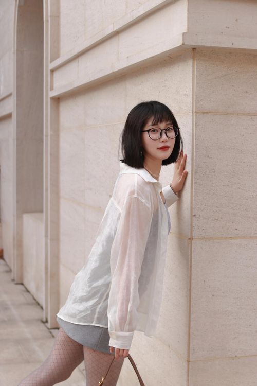 Free A fashionable woman posing in Nanjing, China, showcasing modern urban style. Stock Photo