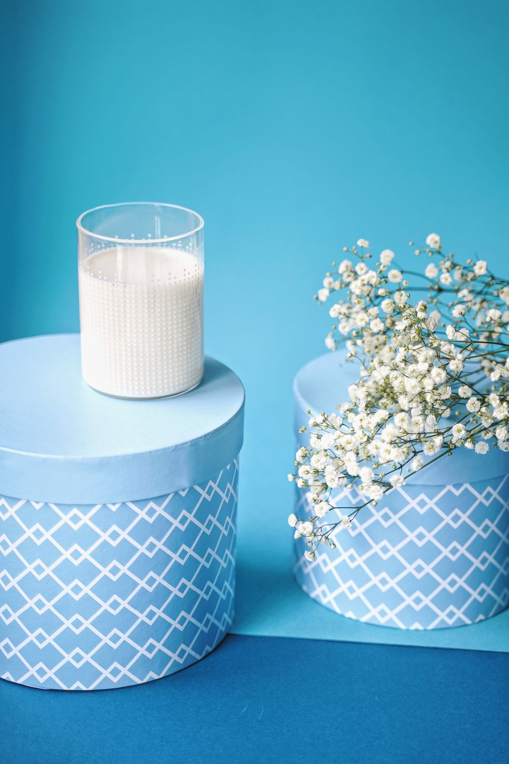 White and Black Blue Round Box on the Table · Free Stock Photo