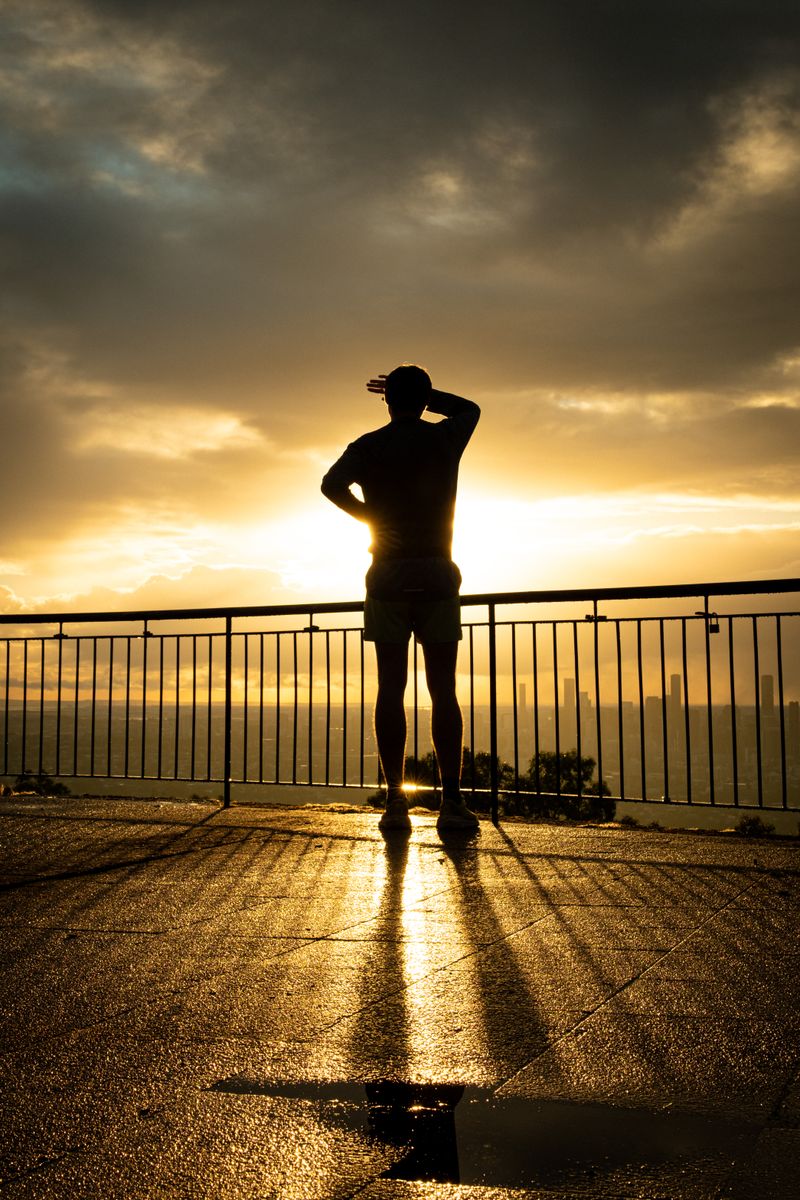 Silhouette at sunrise from the Mount Coot-tha lookout above Brisbane