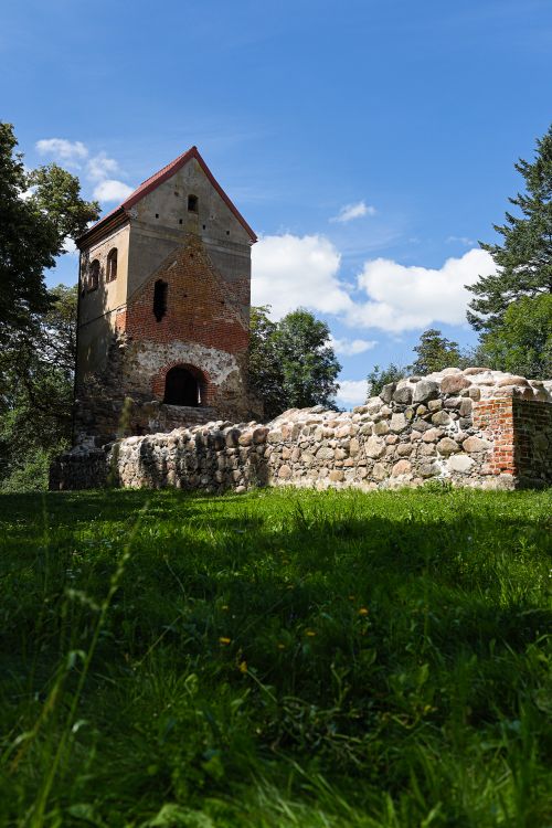 Free Old stone and brick tower surrounded by greenery in Kaliningrad, Russia. Stock Photo