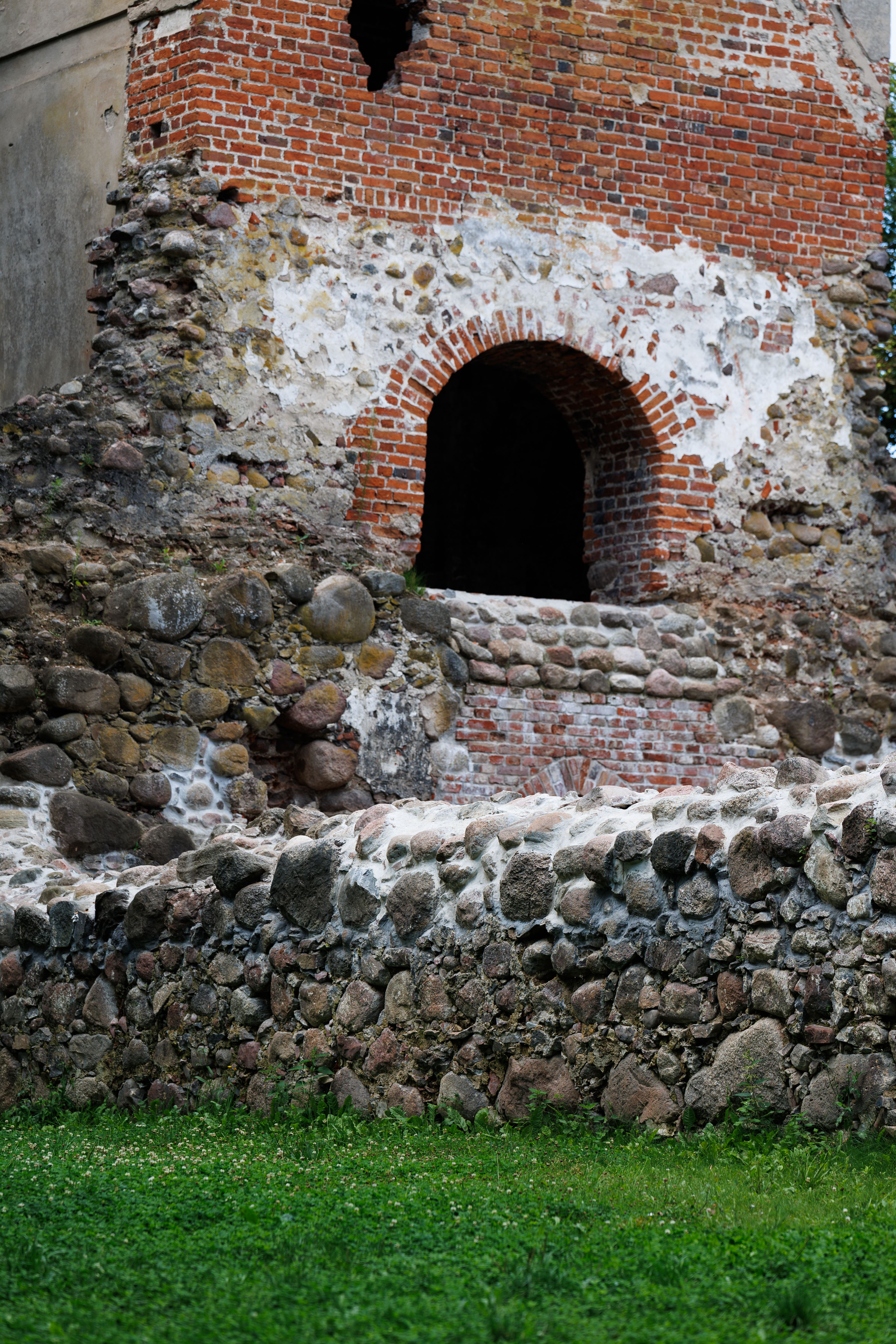Close-up view of old brick ruins in Kaliningrad, displaying weathered stonework and masonry.