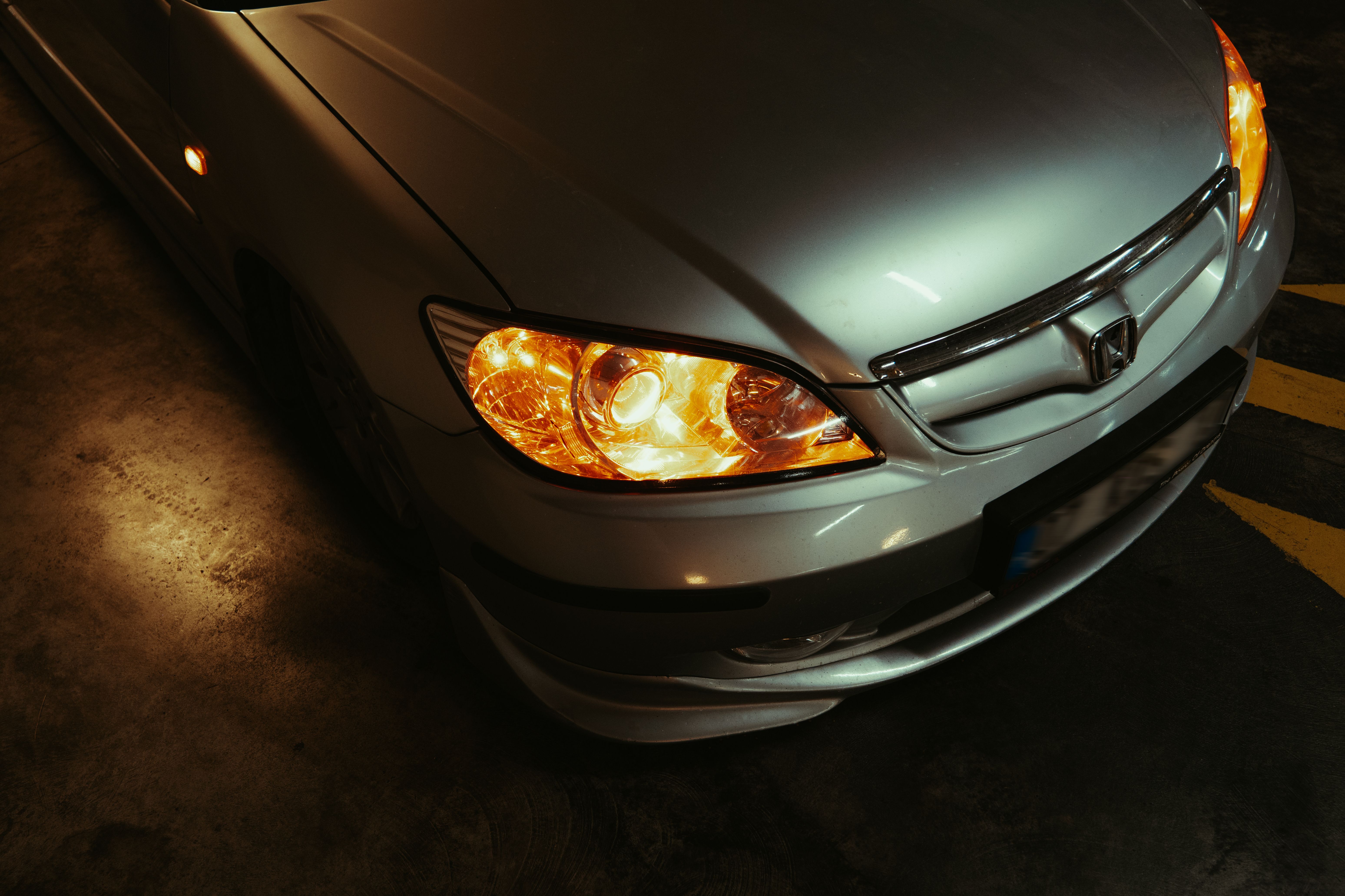 Dimmed headlight beams during evening driving conditions