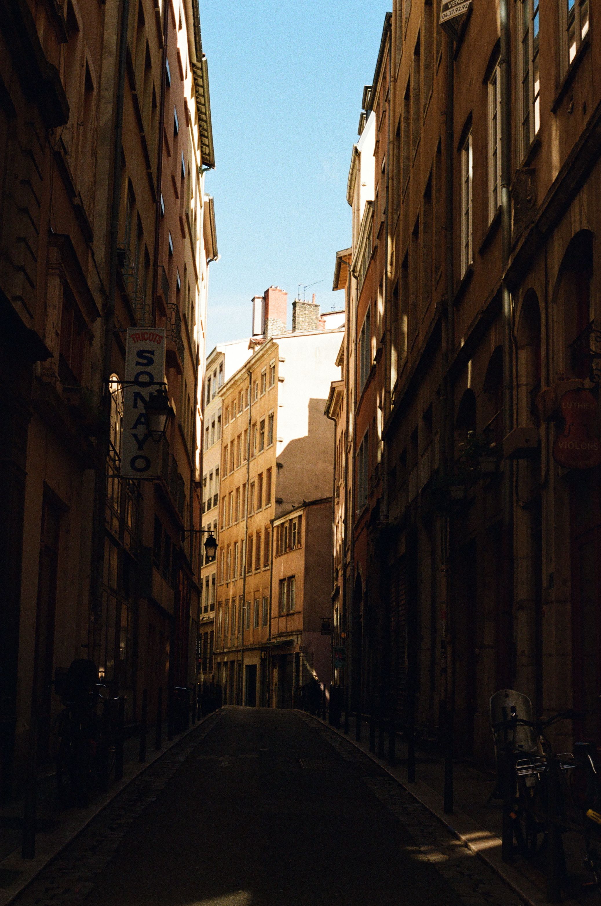 Explore a picturesque alleyway in Lyon's historic district, framed by classic French architecture.