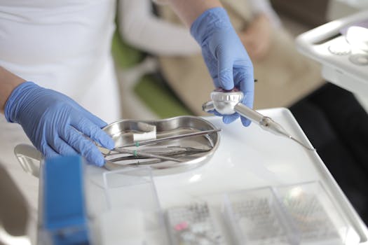 Dental professional handling tools in a sterile clinic environment, ensuring patient hygiene and care.