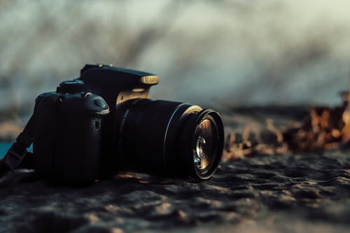 Black Dslr Camera on Ground