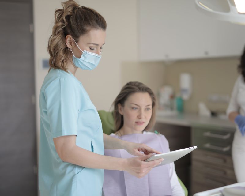 A dentist and patient discussing a smile plan together