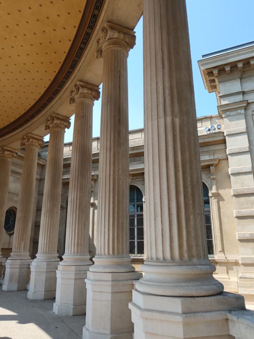 Free Majestic neoclassical columns in an outdoor architectural setting illuminated by daylight. Stock Photo
