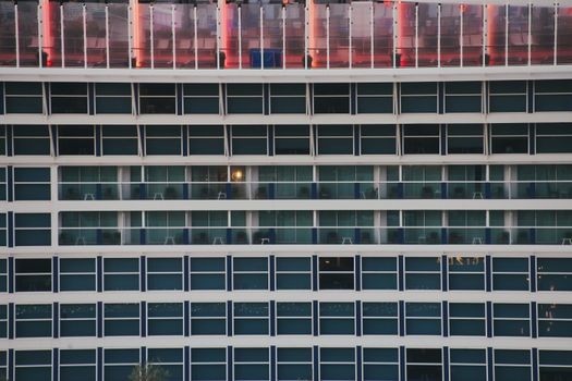 Close-up of cruise ship windows showcasing symmetry and modern design