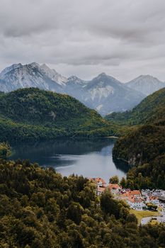 A breathtaking aerial view of Füssen with the Bavarian Alps and lake in the background.
