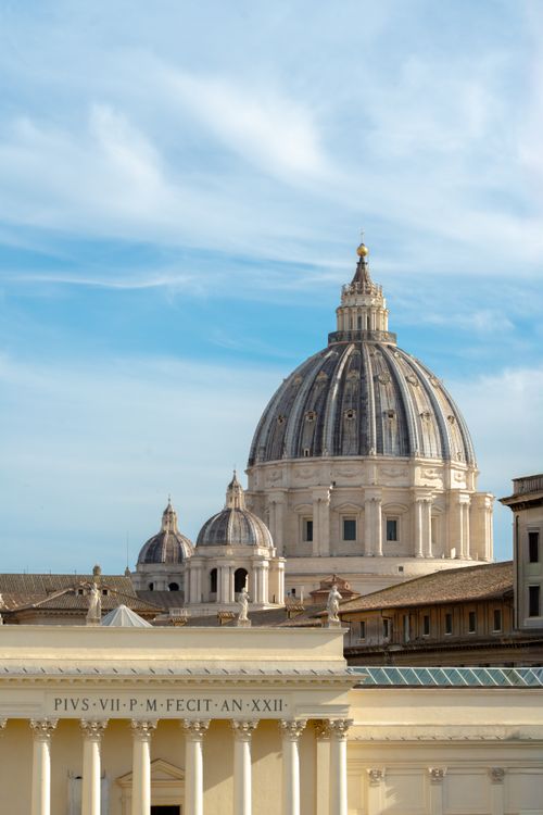 Free View of St. Peter's Basilica Dome, a historic landmark in Vatican City, showcasing Renaissance architecture. Stock Photo