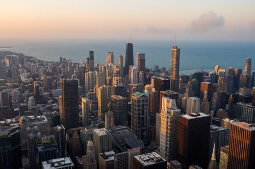 Free Beautiful aerial view of downtown Chicago skyline and Lake Michigan during sunset, highlighting the city's architecture. Stock Photo