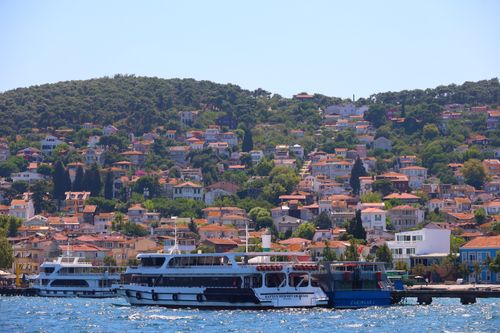Free Ferry cruising near picturesque Prince Islands with charming hillside houses in Istanbul. Stock Photo