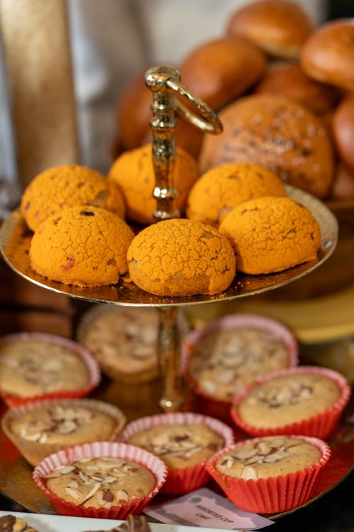 Free A variety of baked goods, including cookies and cupcakes, elegantly displayed on a tiered stand. Stock Photo