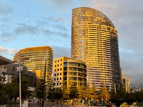 Free Golden light illuminating modern skyscrapers in Melbourne, Australia. Stock Photo