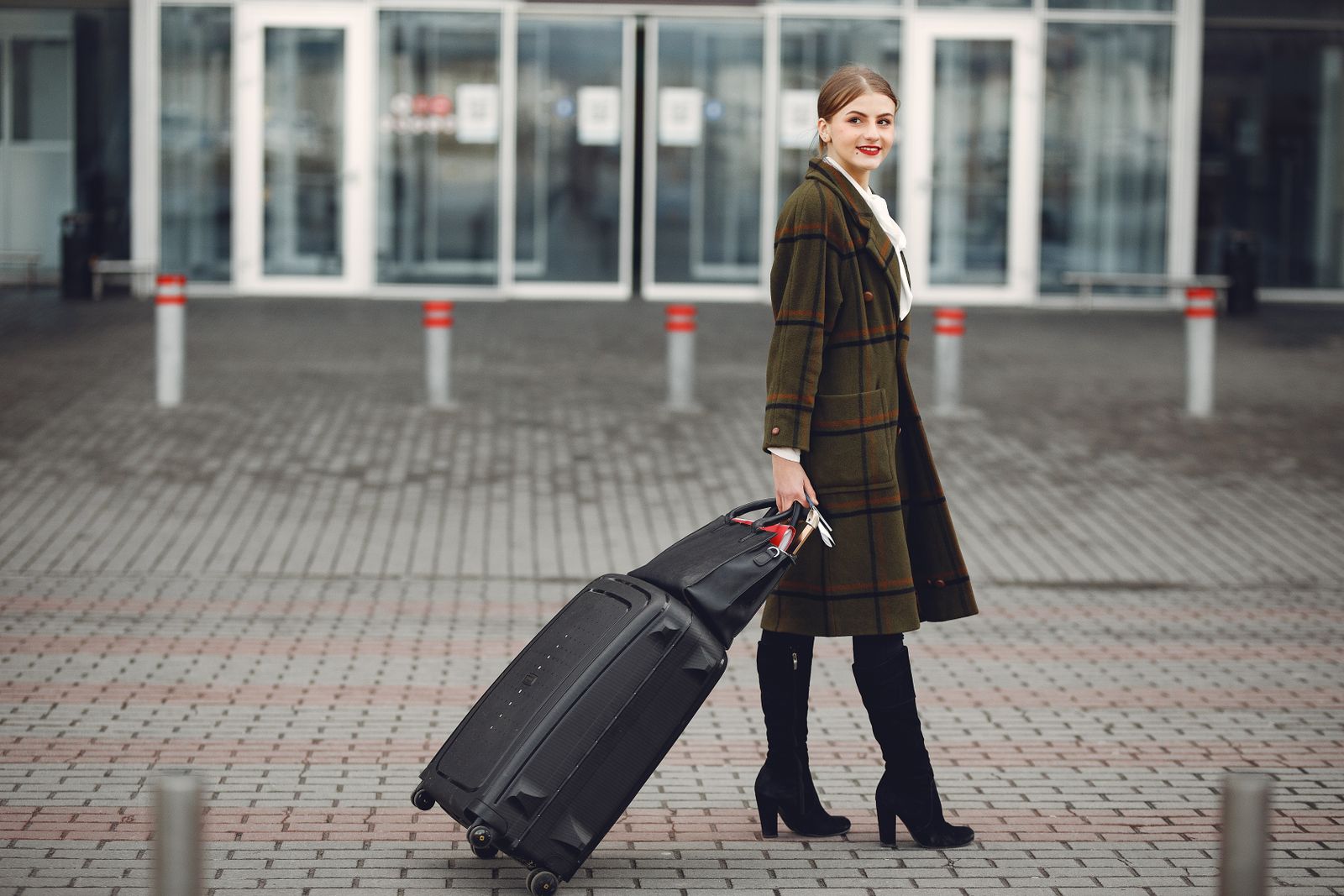 Business traveler walking through an airport with luggage