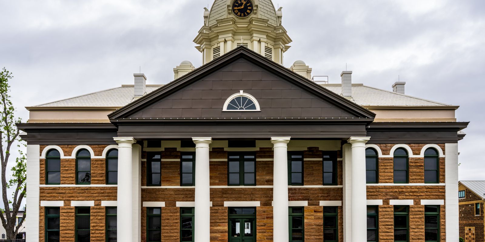 Front view of a historic brick county courthouse