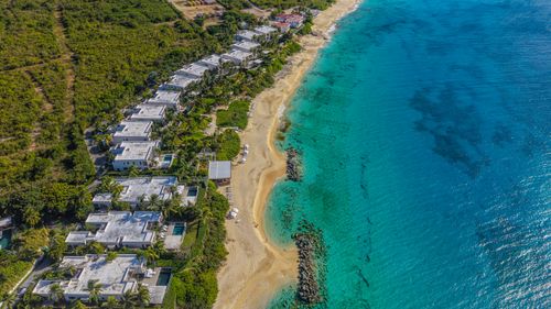 Free A stunning aerial image of luxury resorts along the coastline of Anguilla with turquoise waters. Stock Photo
