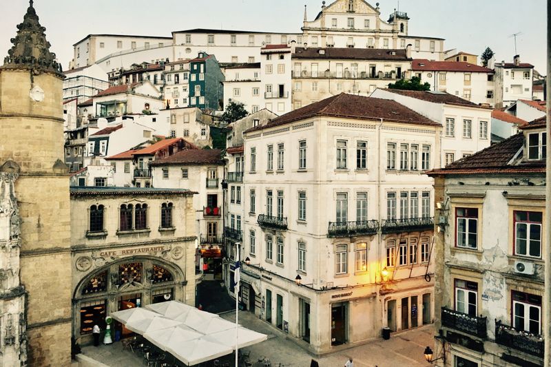 Amazing cityscape of Coimbra with famous historic restaurant and old buildings near Igreja de Santa Cruz Monastery