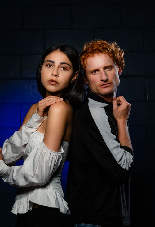 Free Stylish portrait of male and female models posing with attitude under studio lighting. Stock Photo