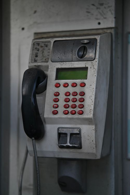 Free Close-up of a classic payphone with red buttons, highlighting vintage technology. Stock Photo