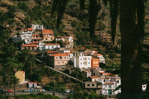 Free Charming hillside village with traditional houses and lush greenery in Valle Gran Rey, Canary Islands. Stock Photo