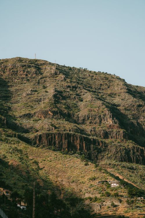 Free Explore the rugged terrain and volcanic formations of Valle Gran Rey in the Canary Islands. Stock Photo