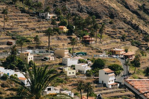 Free A picturesque view of traditional houses and terraced fields in Valle Gran Rey, La Gomera, Canary Islands. Stock Photo