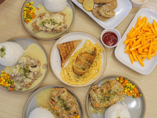 Overhead view of home-cooked rice and chicken dishes — photo by JLT Projects on Pexels