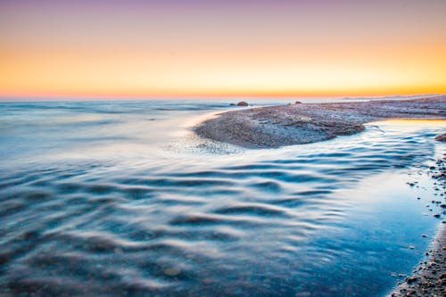 Free Body of Water during Golden Hour Stock Photo