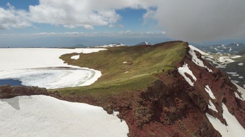 Free Breathtaking aerial view of hikers on Armenian mountain ridge during summer. Stock Photo