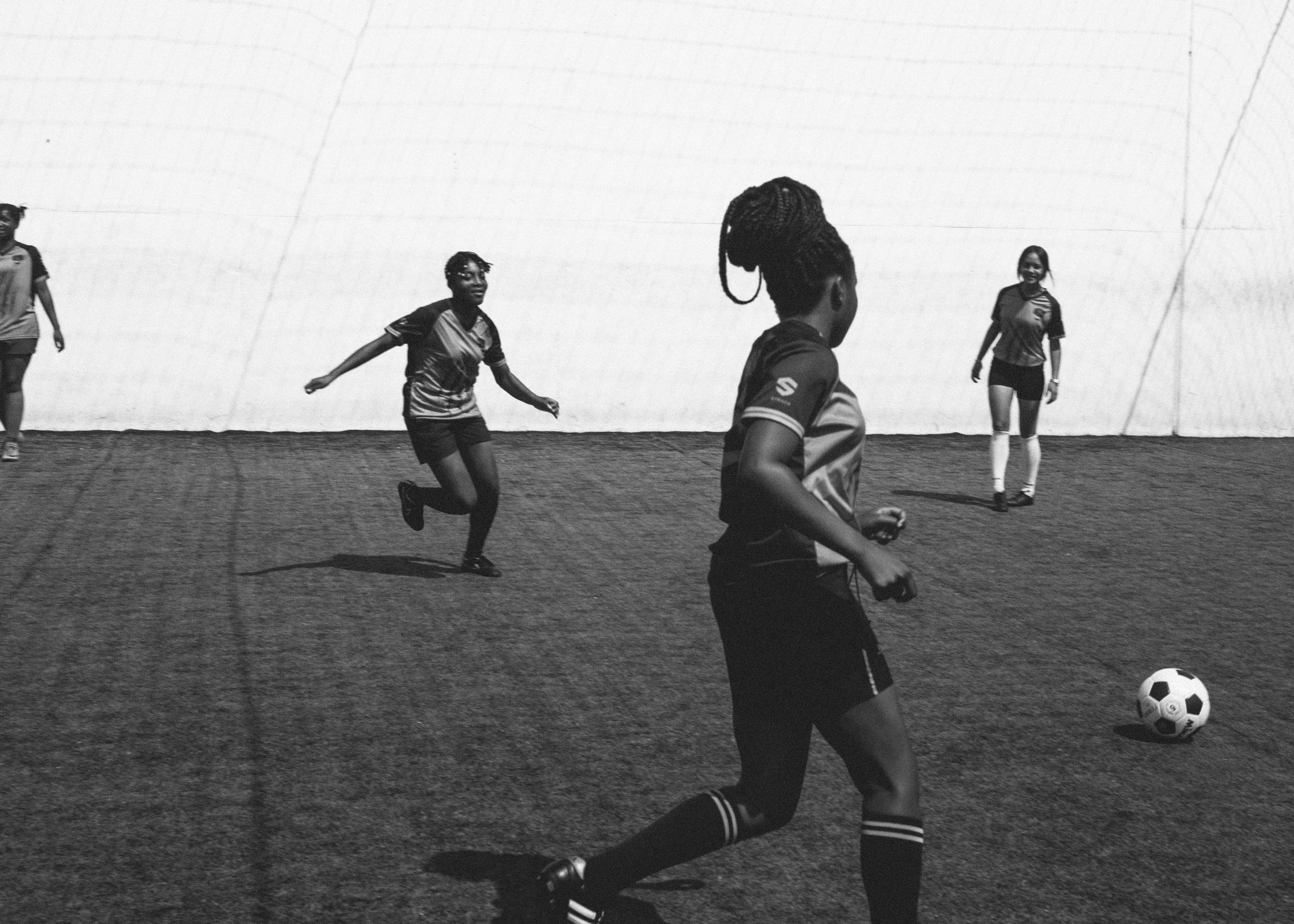 female football team cheerfully playing in football