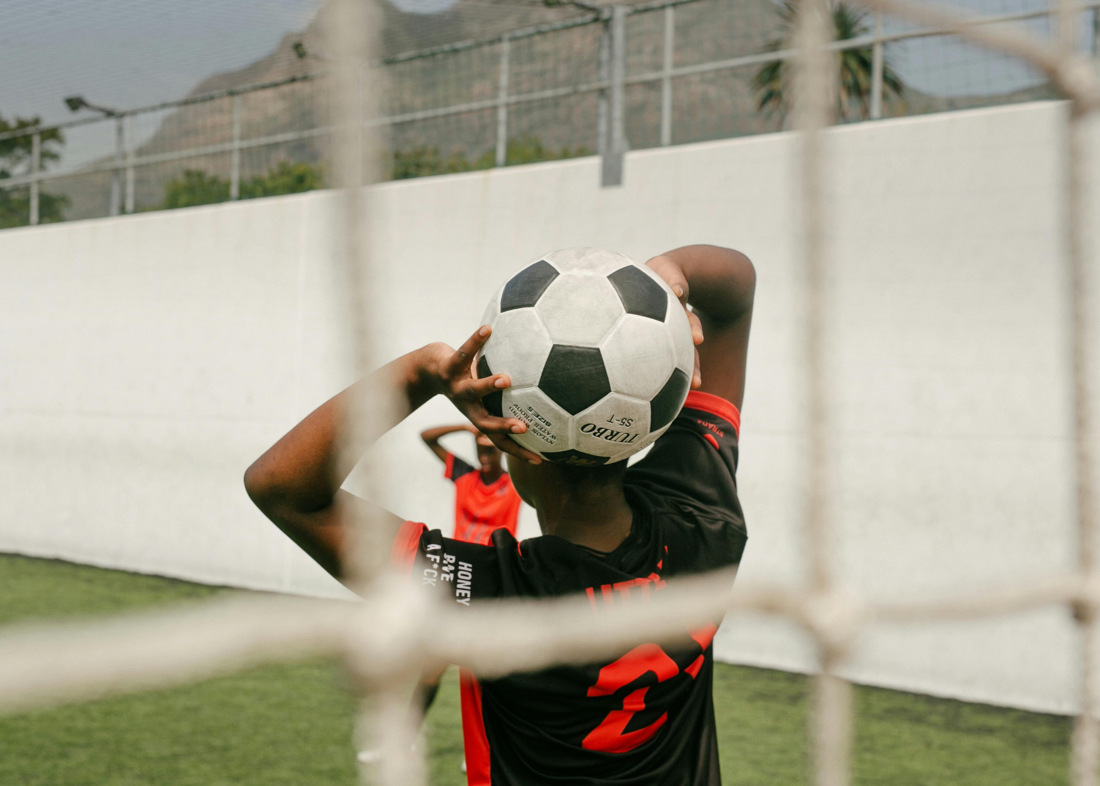 a player holding a soccer ball
