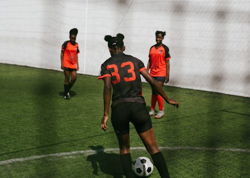 Women playing in soccer on stadium