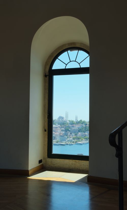 Free A beautiful view of Istanbul's historic skyline through an arched window, showcasing cityscape and waterfront. Stock Photo