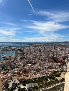 Stunning aerial view showcasing the expansive cityscape and harbor of Alicante, Spain.