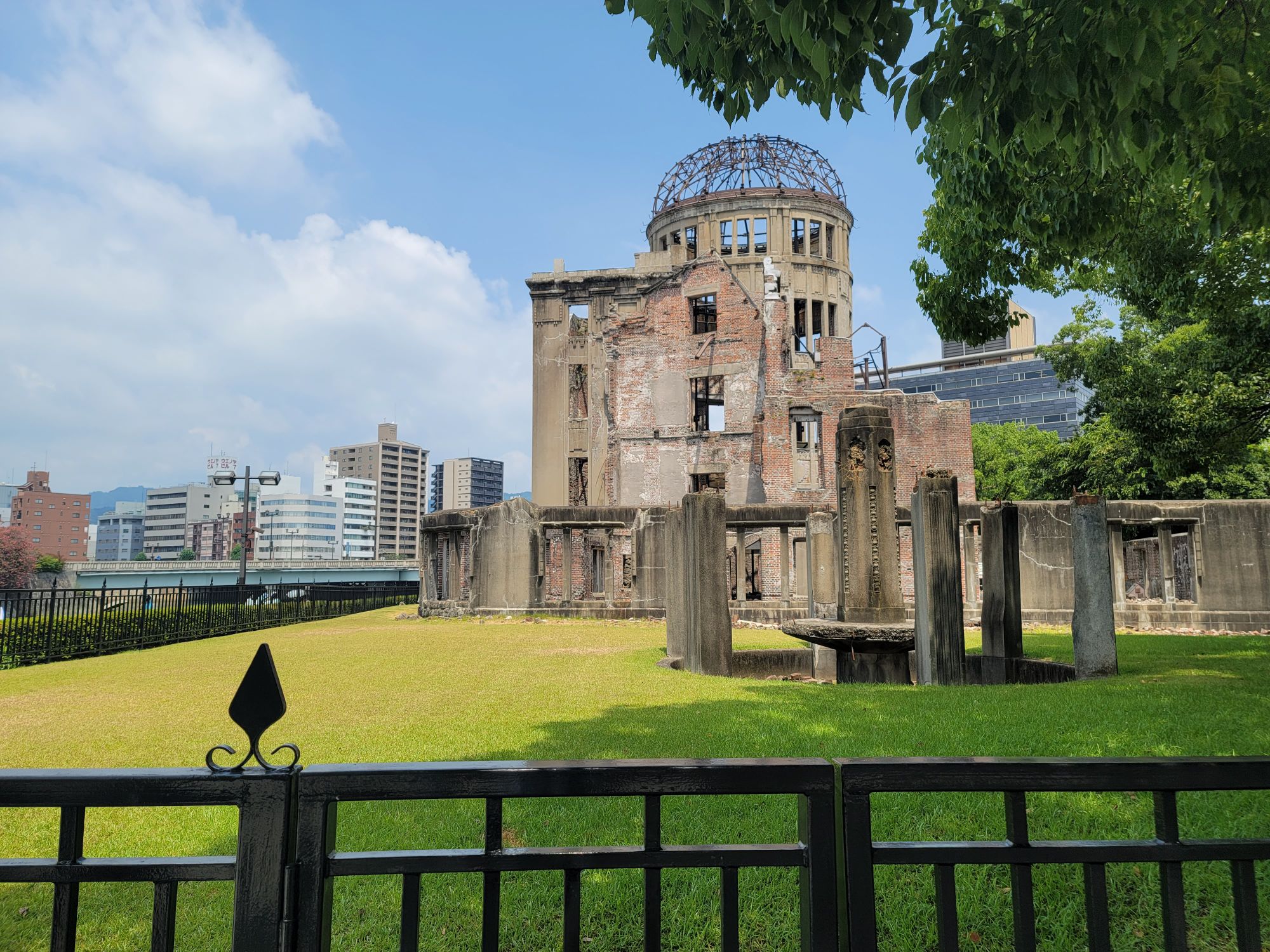 The Hiroshima Peace Memorial, a poignant reminder of history, stands under a bright sky.