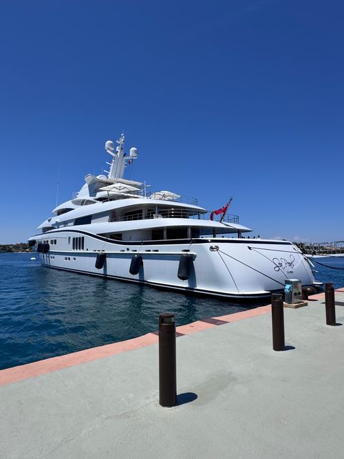 Free Elegant yacht moored at a pier in Porto Cervo, Sardinia on a sunny day. Stock Photo