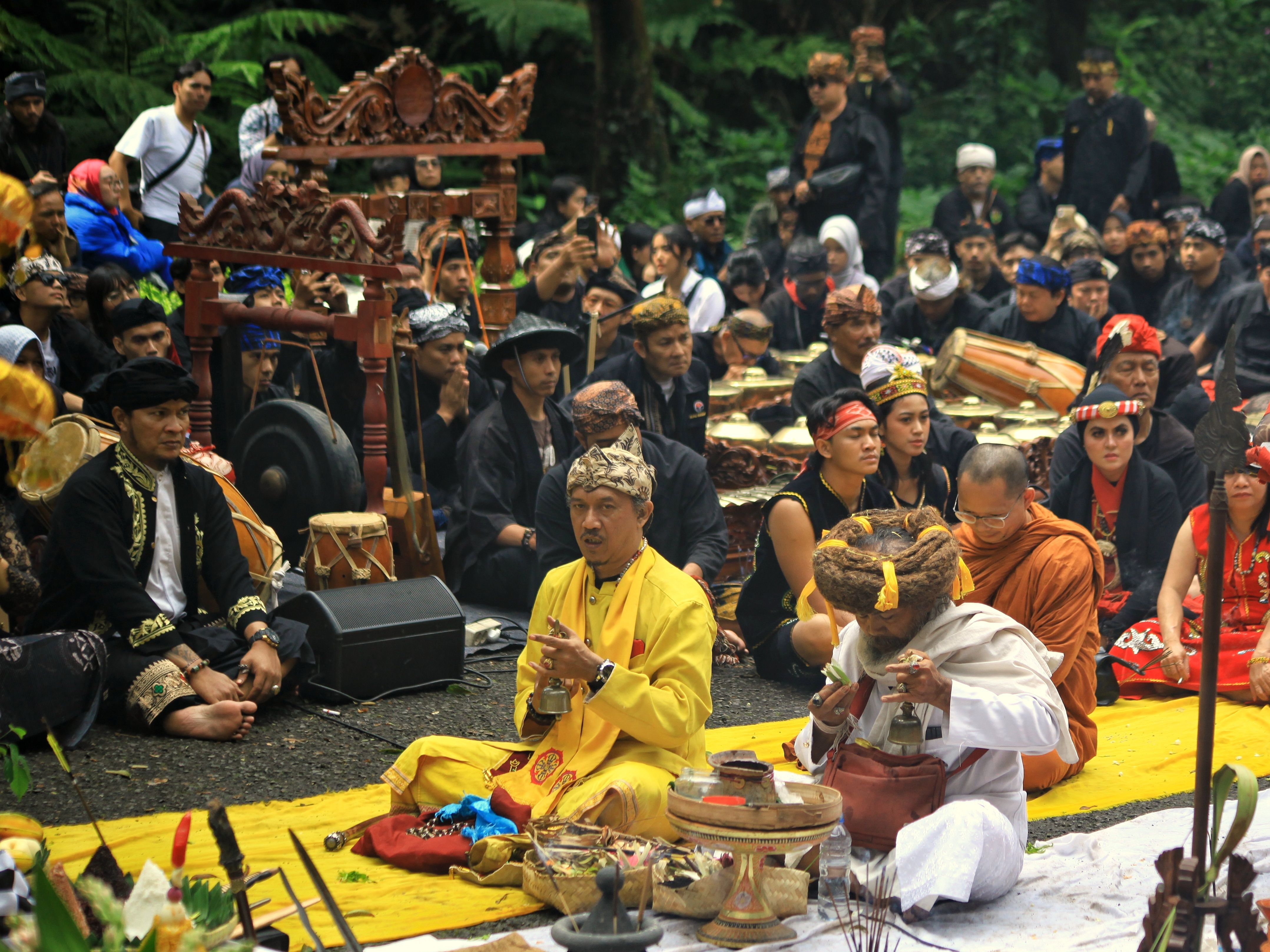 Cultural gathering featuring traditional Indonesian costumes and rituals in West Java.