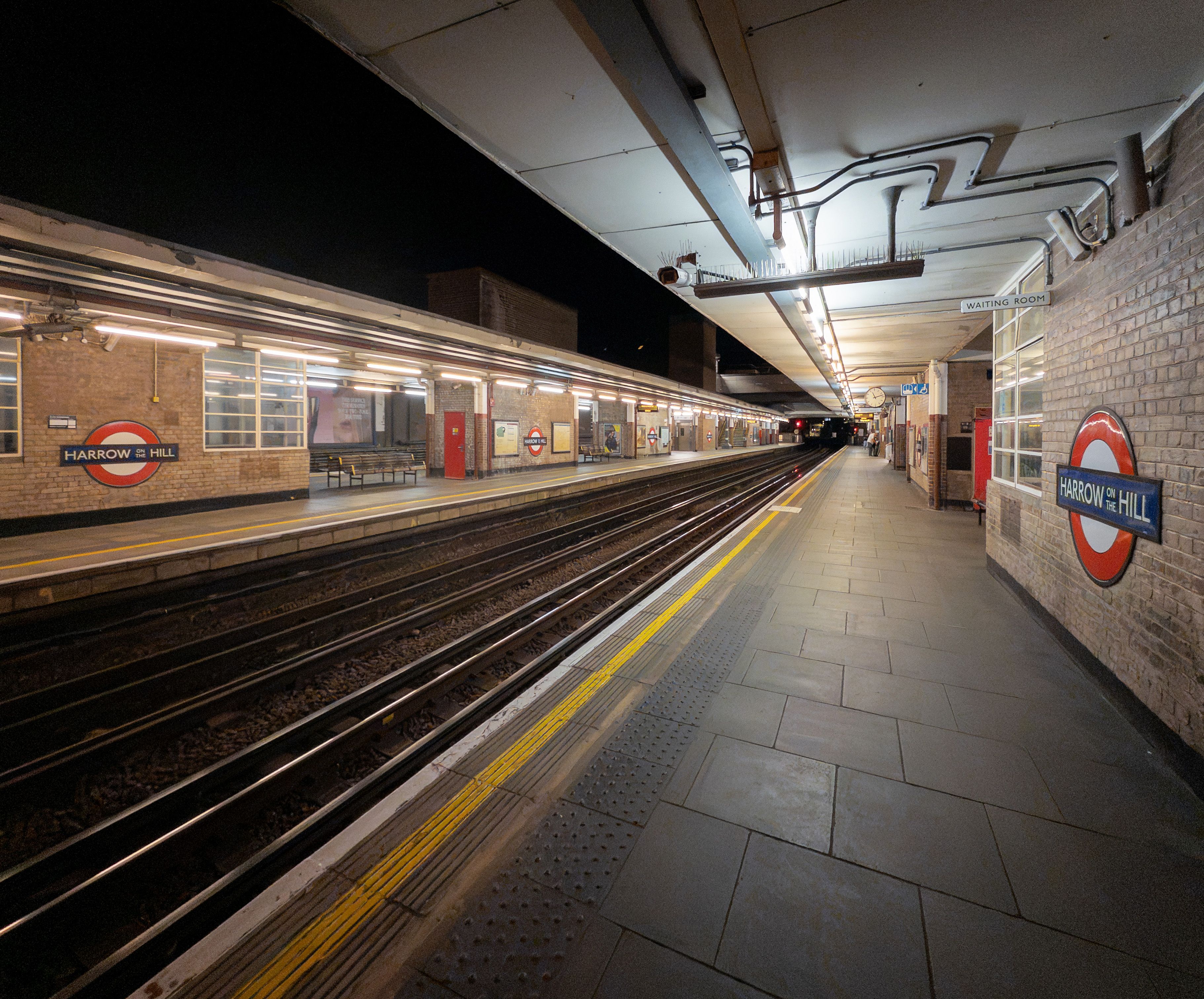 A night view of Harrow on the Hill station, part of London's Metropolitan Line.