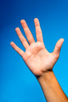 An open hand raised against a blue gradient background, symbolizing five or stop.