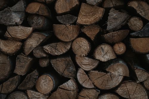 Free Close-up view of neatly stacked firewood logs, showcasing texture and pattern. Stock Photo