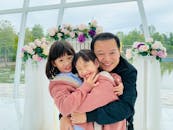 Portrait Of Two Girls With Their Father