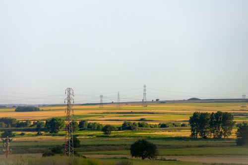 Free Idyllic landscape of Vize, Türkiye, showcasing fields with power lines under a clear summer sky. Stock Photo