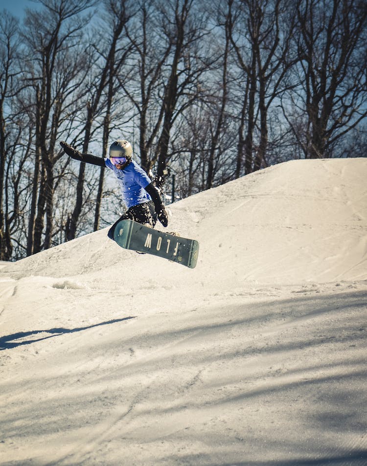 Man In Snowboard Doing A Mid Air Jump