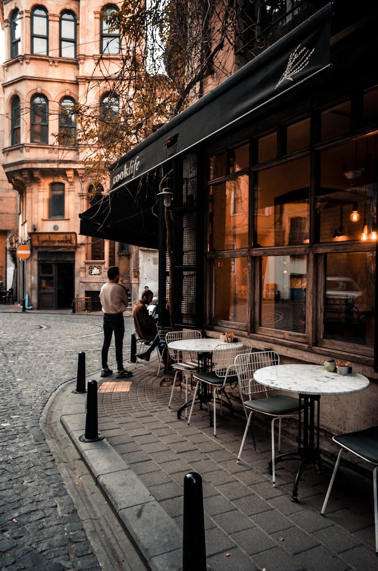 People In Cafe On Street In City