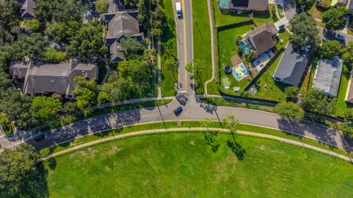 Free Aerial shot of a suburban neighborhood in Florida, showcasing roads, homes, and greenery. Stock Photo