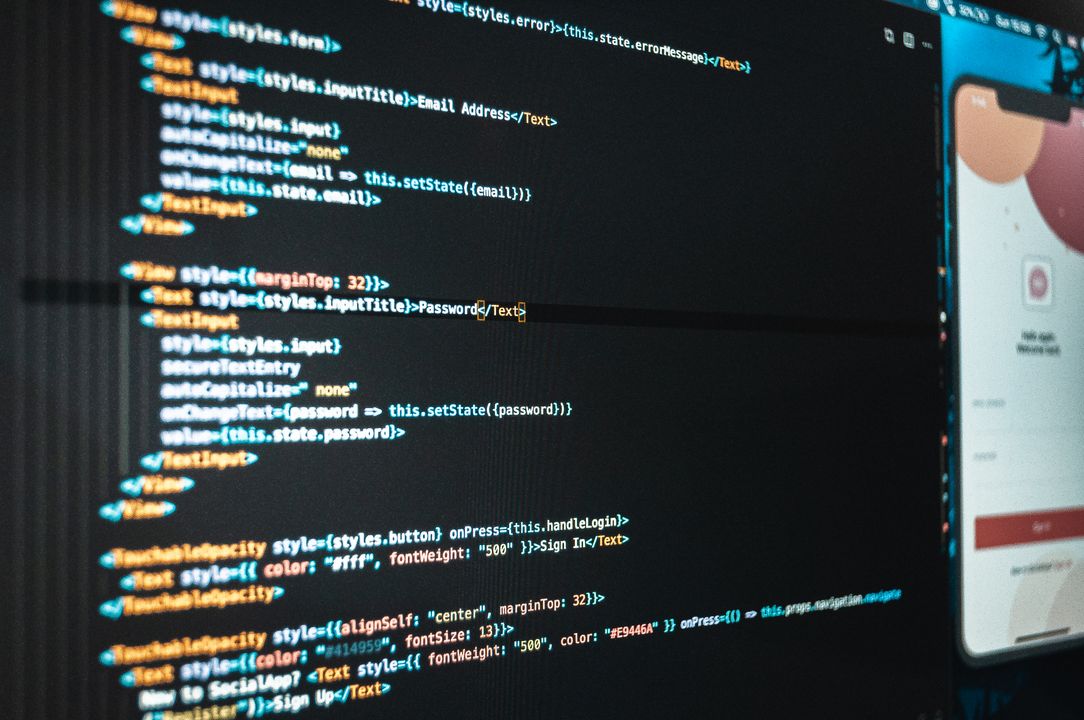 تصميم موقع الكتروني مع ربط نفاذ الوطني - Saudi developer designing secure Nafath login flow on laptop
