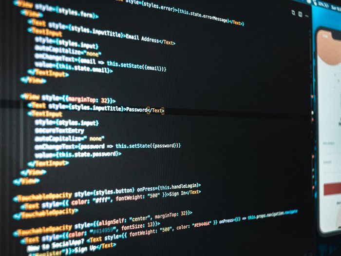 Developer writing code on a computer